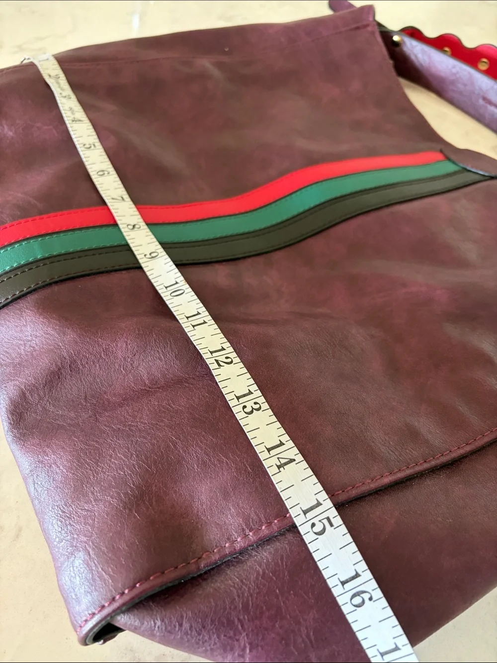 Large Burgundy leather bag with red and green accents